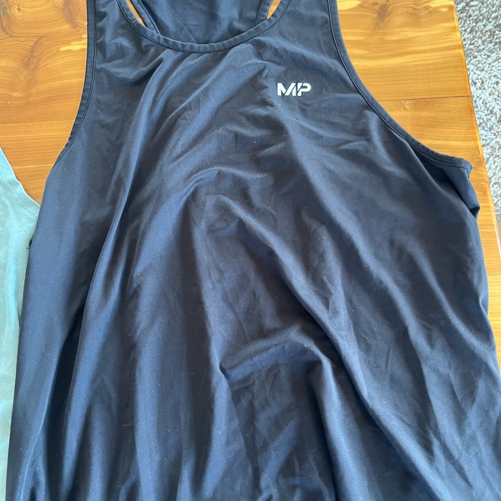 Two medium men’s work out tank tops.